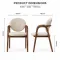Wooden armrest and upholstered back detail of dining chair